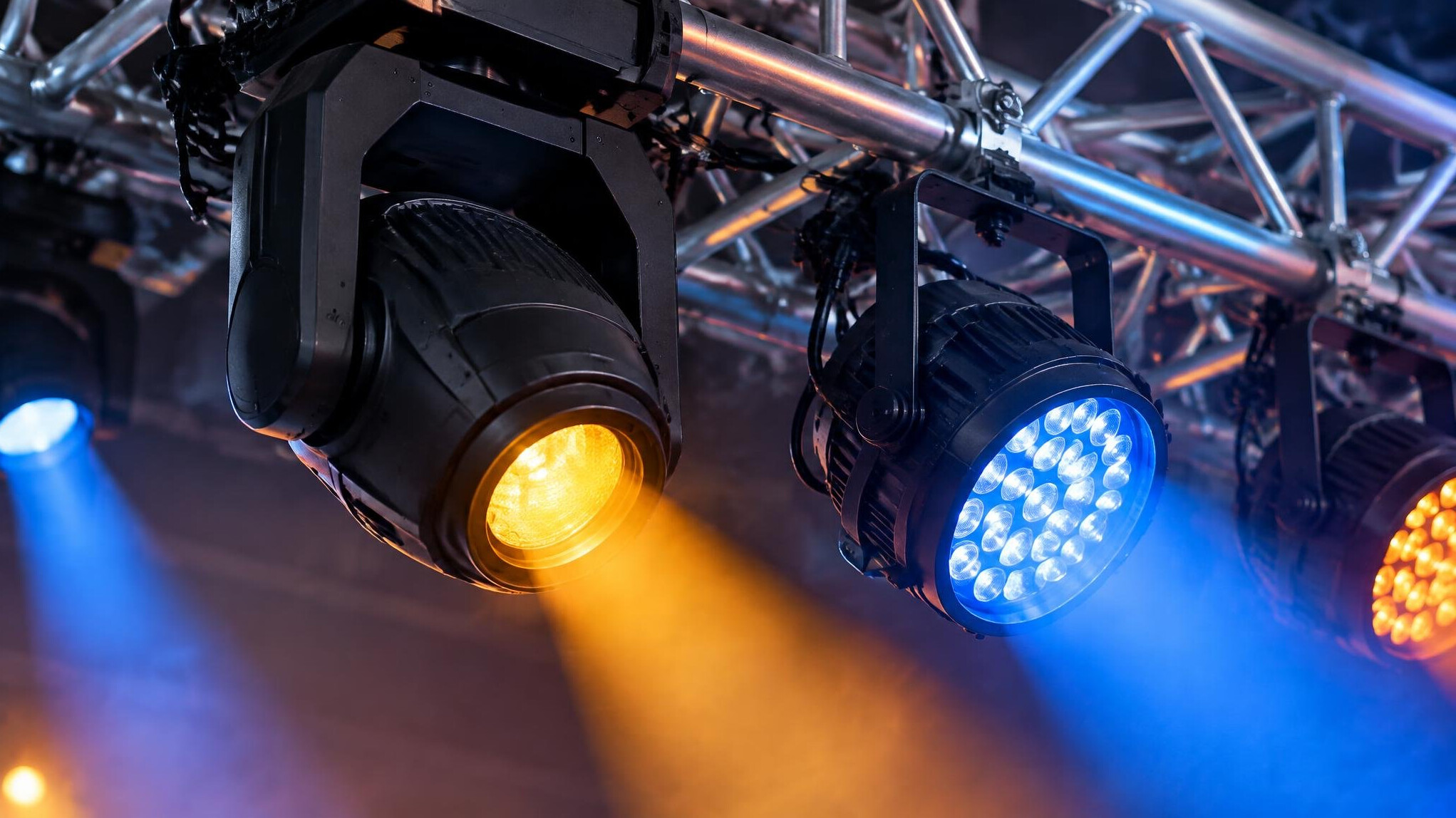 Close up of stage lighting fixtures on a truss