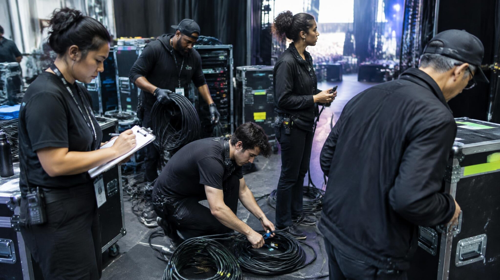 Production crew working backstage before a live show